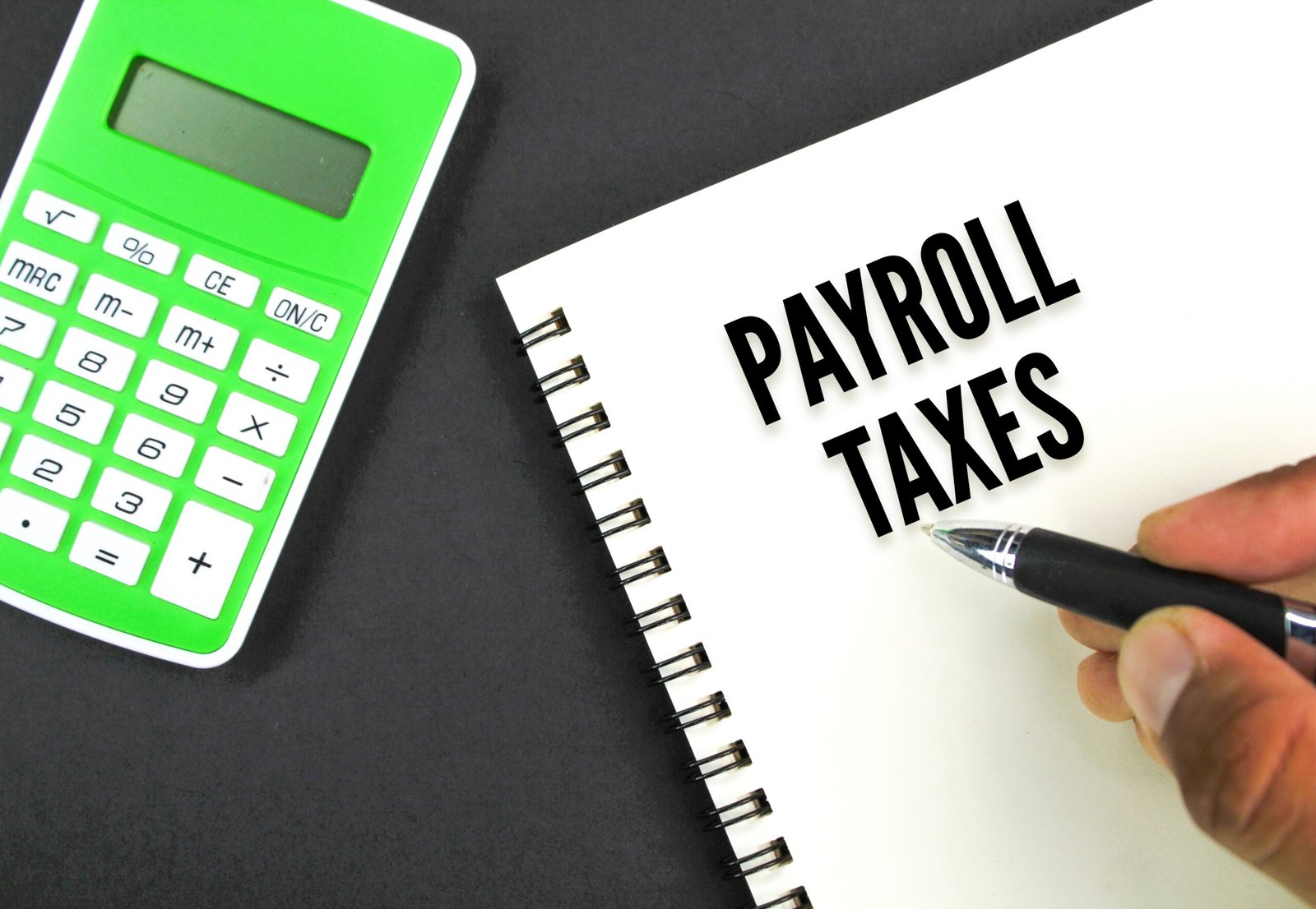 calculator-book-and-hand-holding-a-pen-with-the-w-2025-03-09-21-06-51-utc c corporation tax preparation