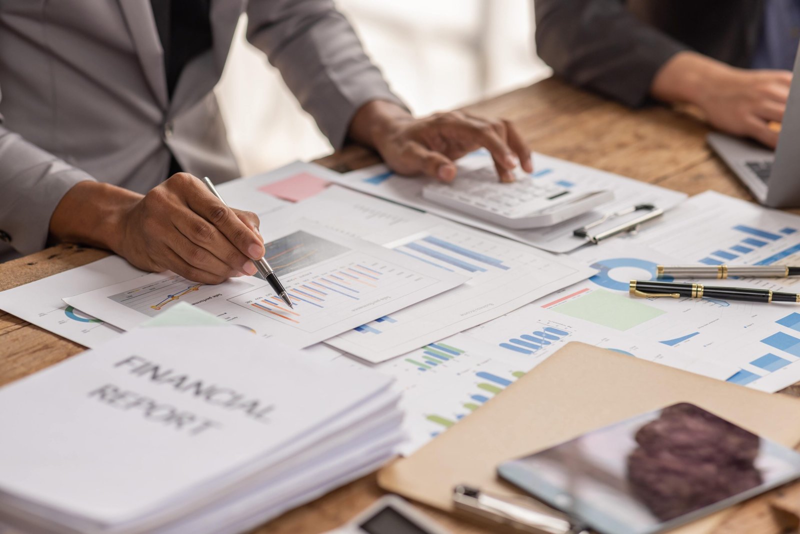 group-of-confident-business-people-point-to-graphs-2025-02-21-16-53-02-utc-min c corporation tax preparation