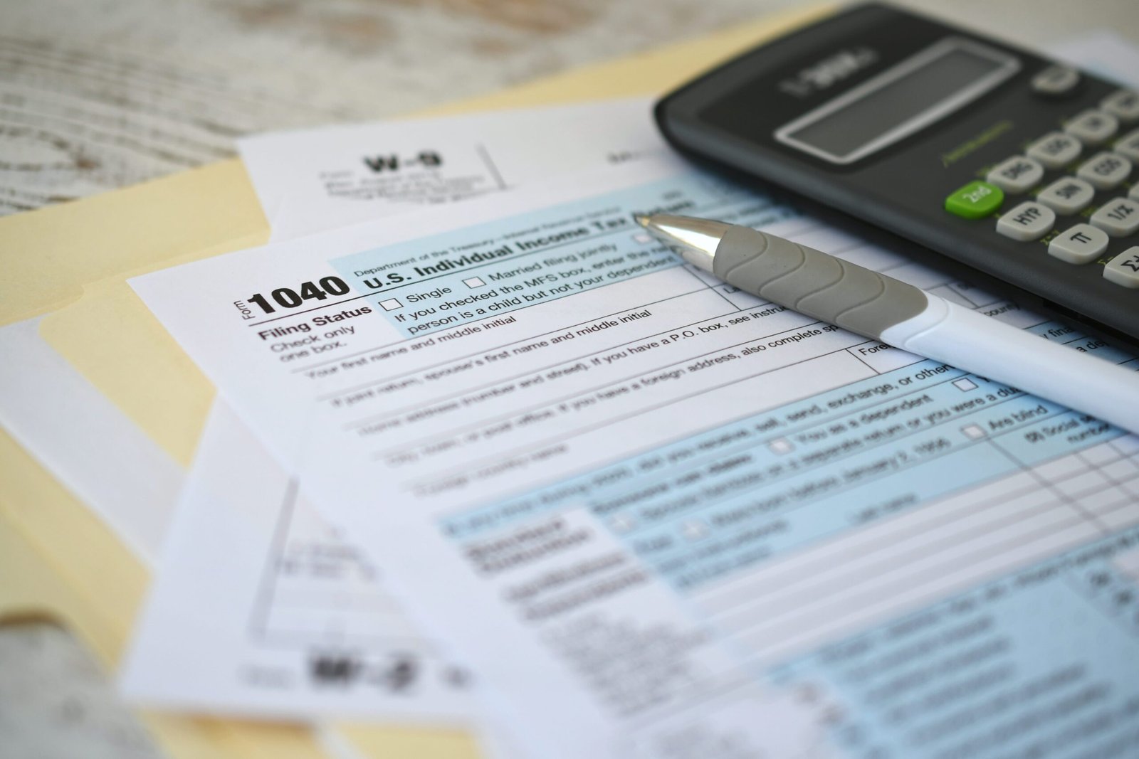 irs-1040-tax-return-form-with-ink-pen-and-calculat-2025-03-11-18-21-19-utc-min c corporation tax preparation